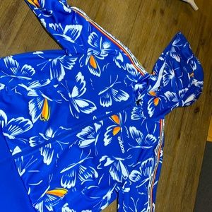 Adidas zip up it’s blue with white, orange and a bit of yellow